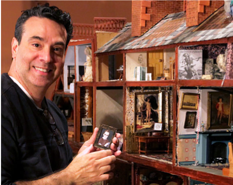 A photo of the lecturer, Darren Scala, with some of his miniatures