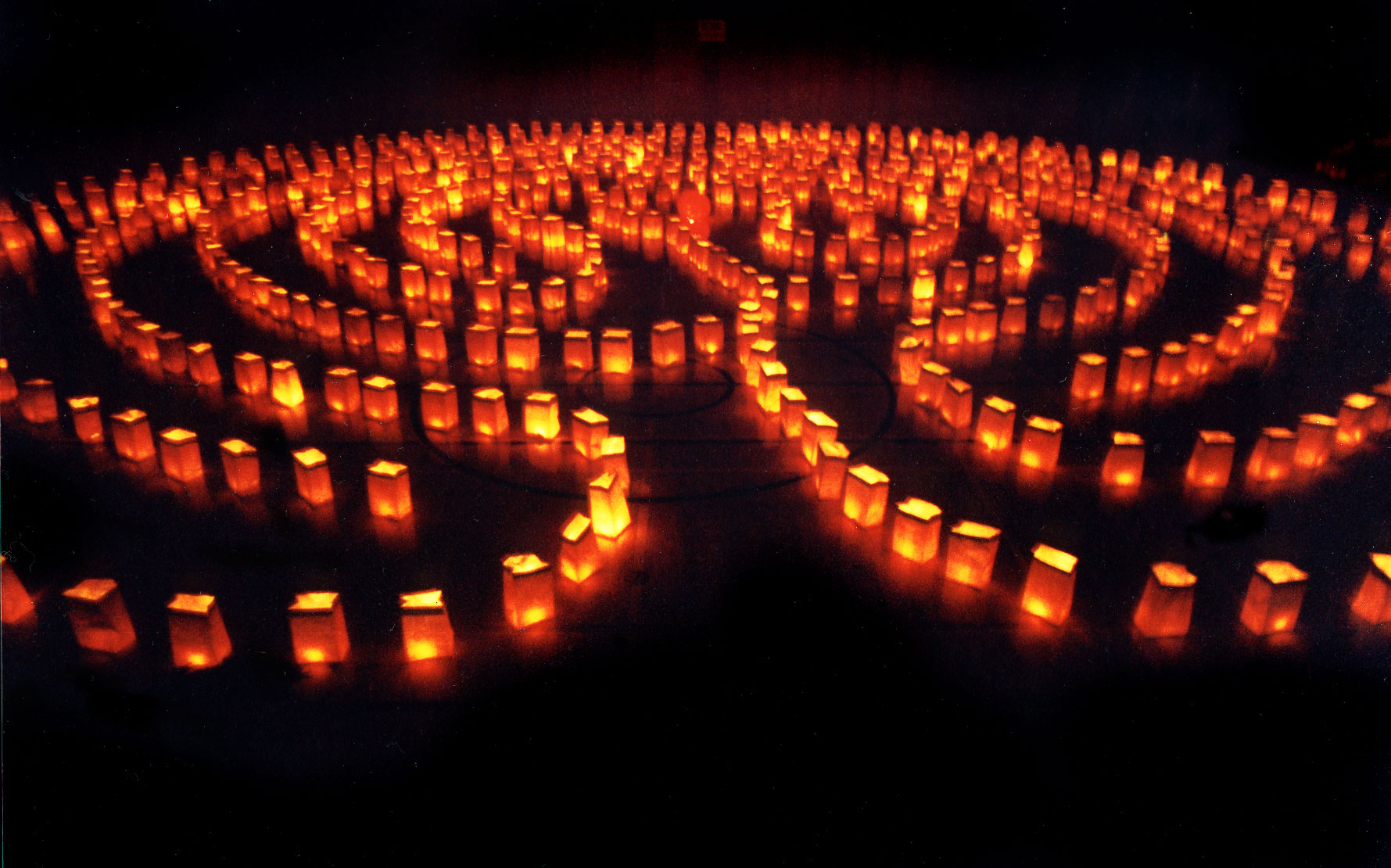 A picture of a labyrinth lit up by illuminated paper bags