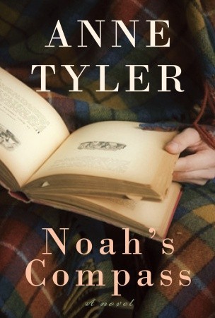 Book cover for Noah's Compass which is a photo of someone holding an open book.