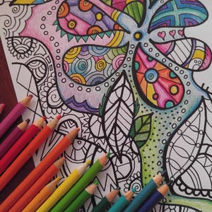 colored pencils and a half completed coloring sheet