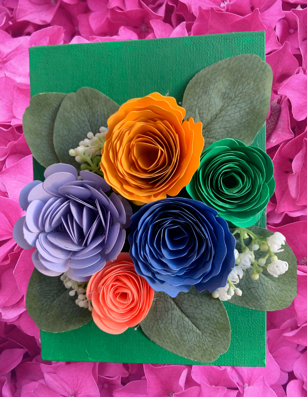 5 flowers made of different color paper