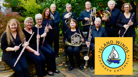 The Island Winds Chamber Ensemble seated outdoors