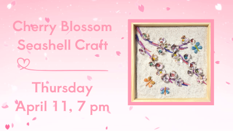 A cherry blossom branch made of seashells on sand.