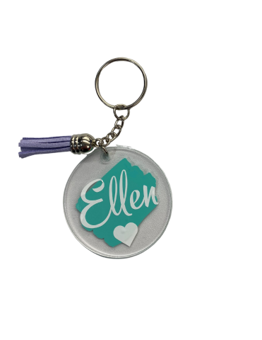 Sample Picture of a Clear Round Keychain with a Brushstroke Background and a Name in White Lettering