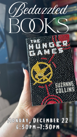 an arm holding the hunger games book with gems on the cover and program details