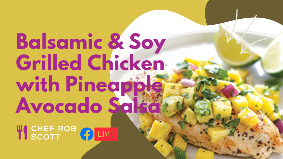 A plate with grilled chicken topped with pineapple avocado salsa and lime wedges on it.