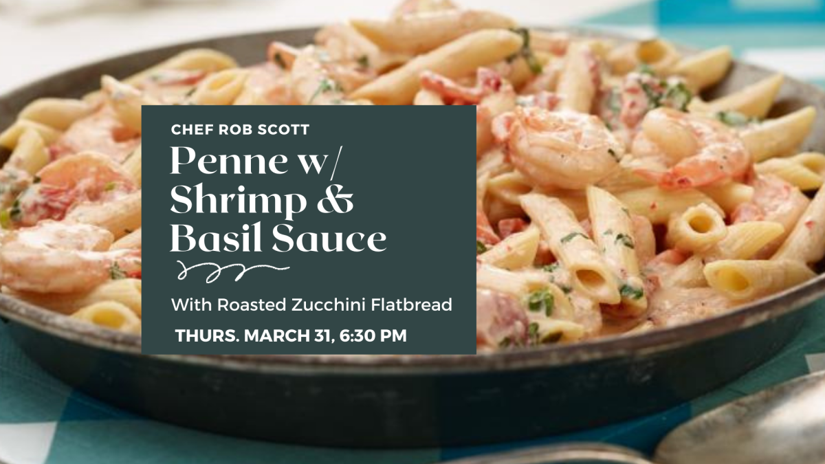 Photograph of penne and shrimp in a pan w/ tomatoes and basil