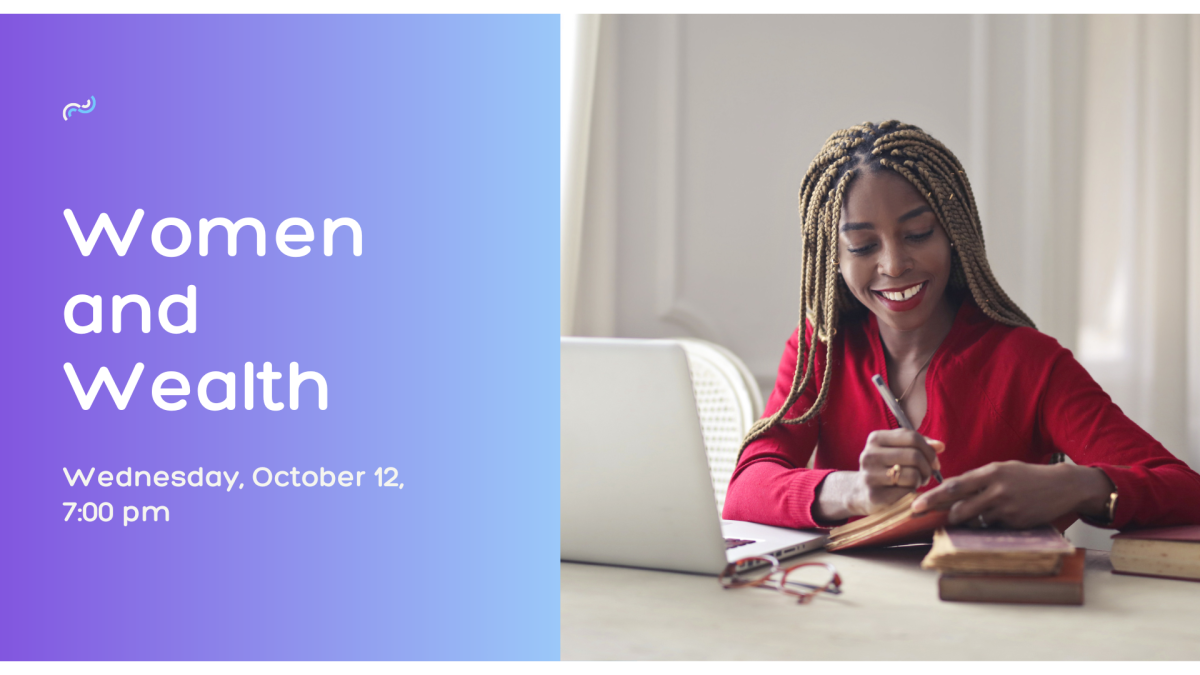 A photo of an african american woman sitting at a desk with a laptop in front of her.